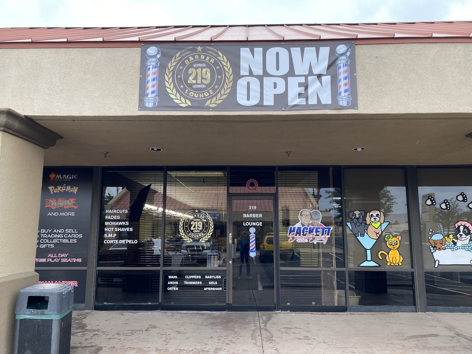 Exterior storefront with '219 Barber Lounge NOW OPEN' banner