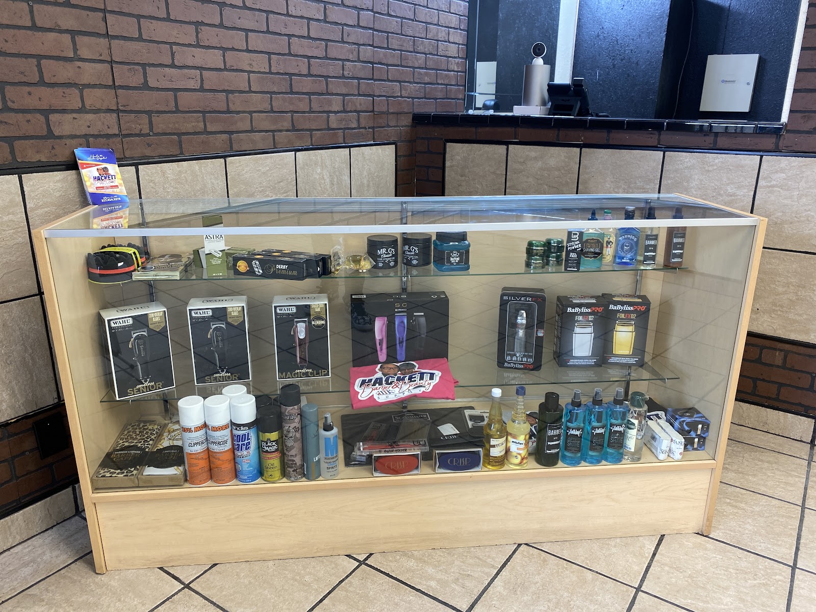 Retail display case with clippers, trimmers and grooming products