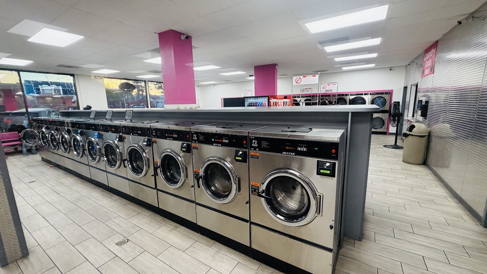 Wide interior view of long row of Dexter washers