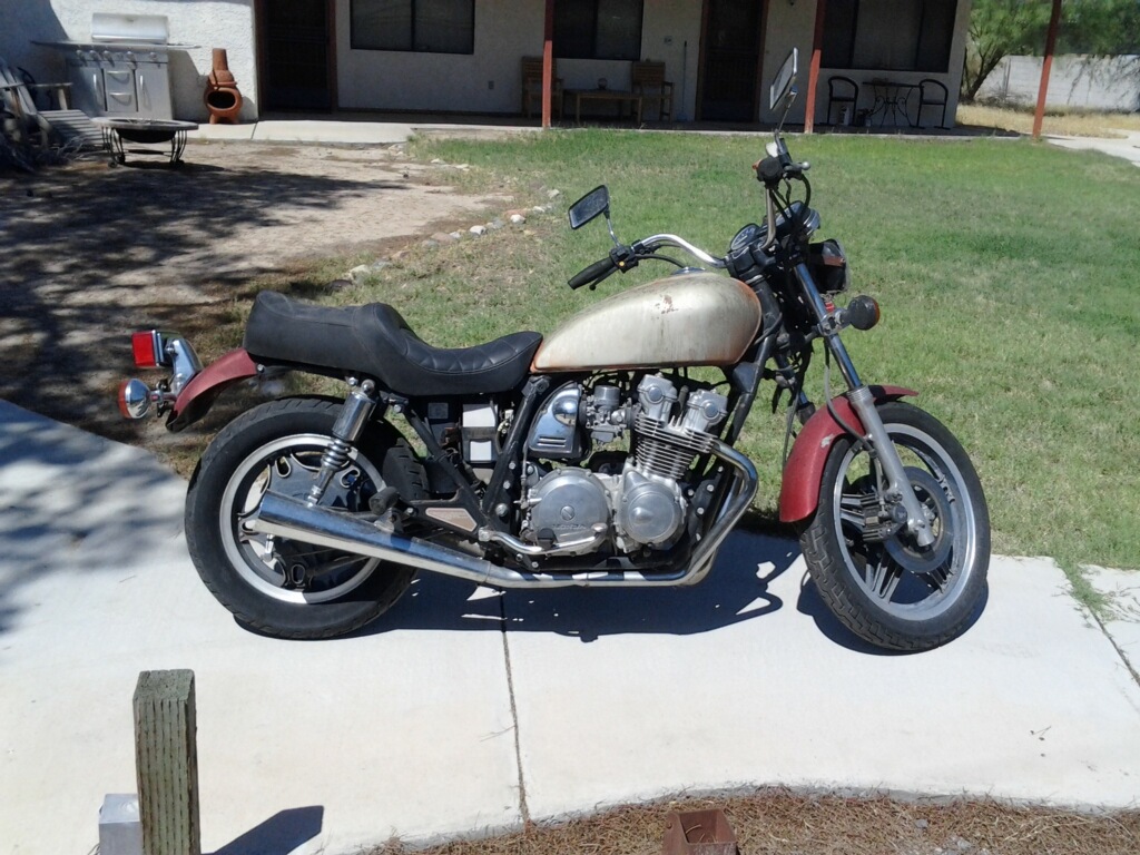 Honda cruiser motorcycle parked on a driveway before restoration