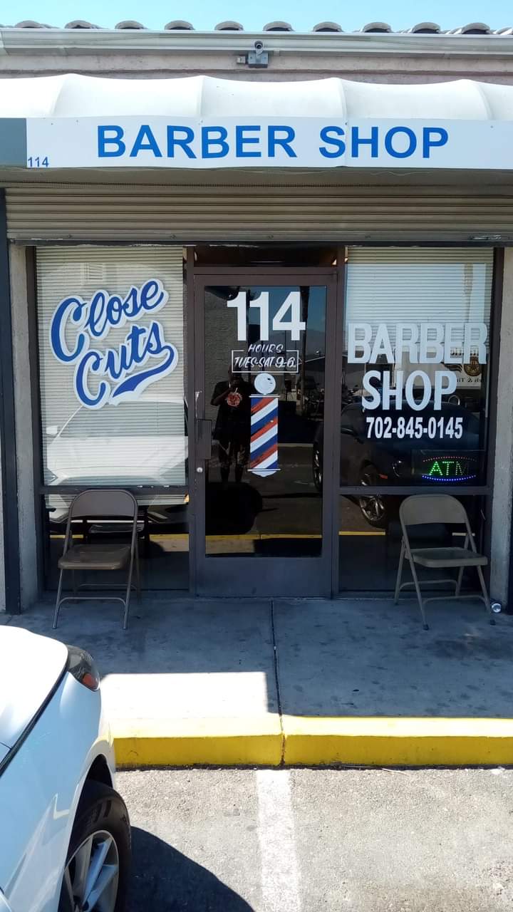 Exterior of Close Cuts Barber Shop storefront at unit 114
