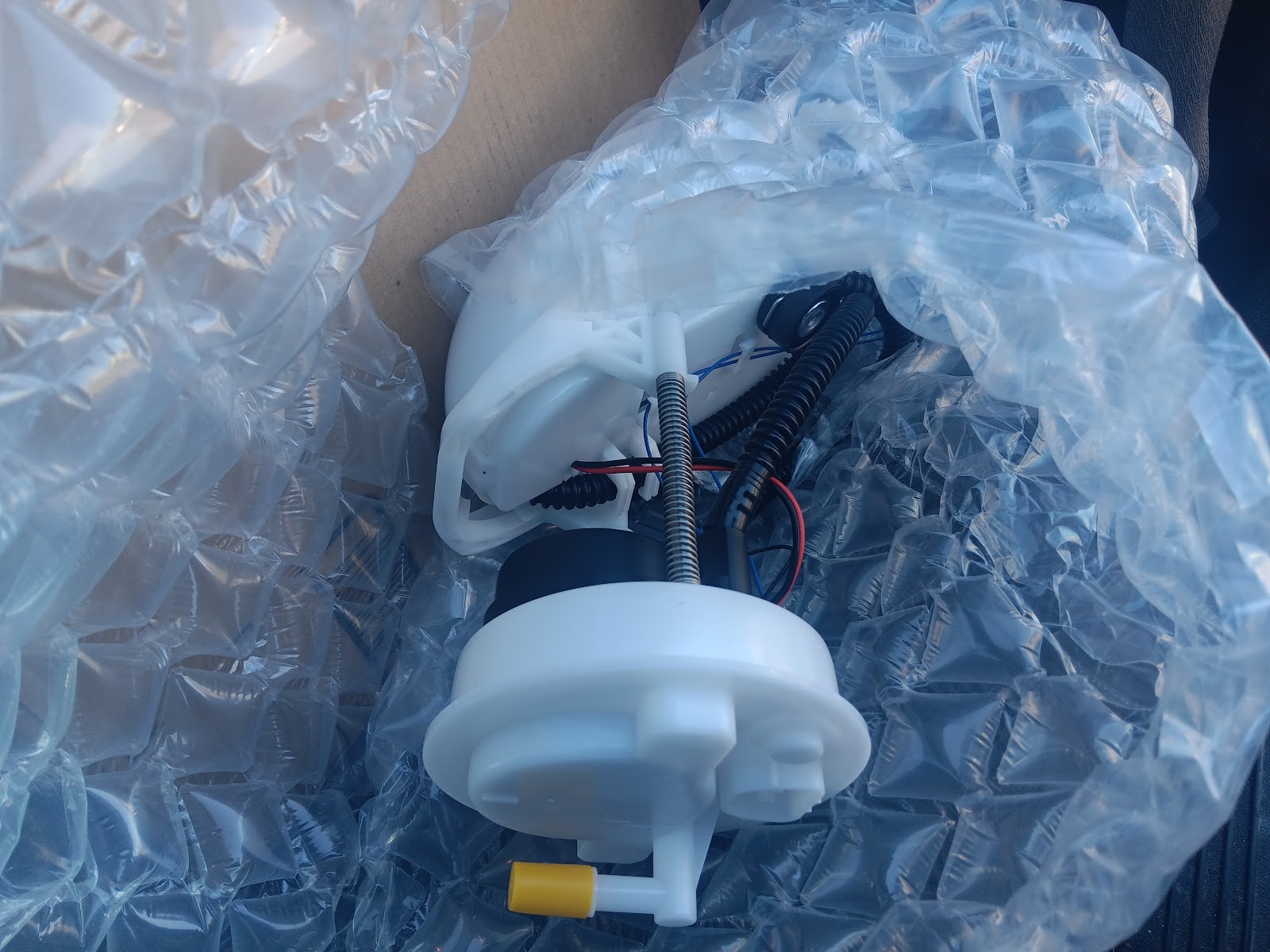 New fuel pump assembly in bubble wrap packaging