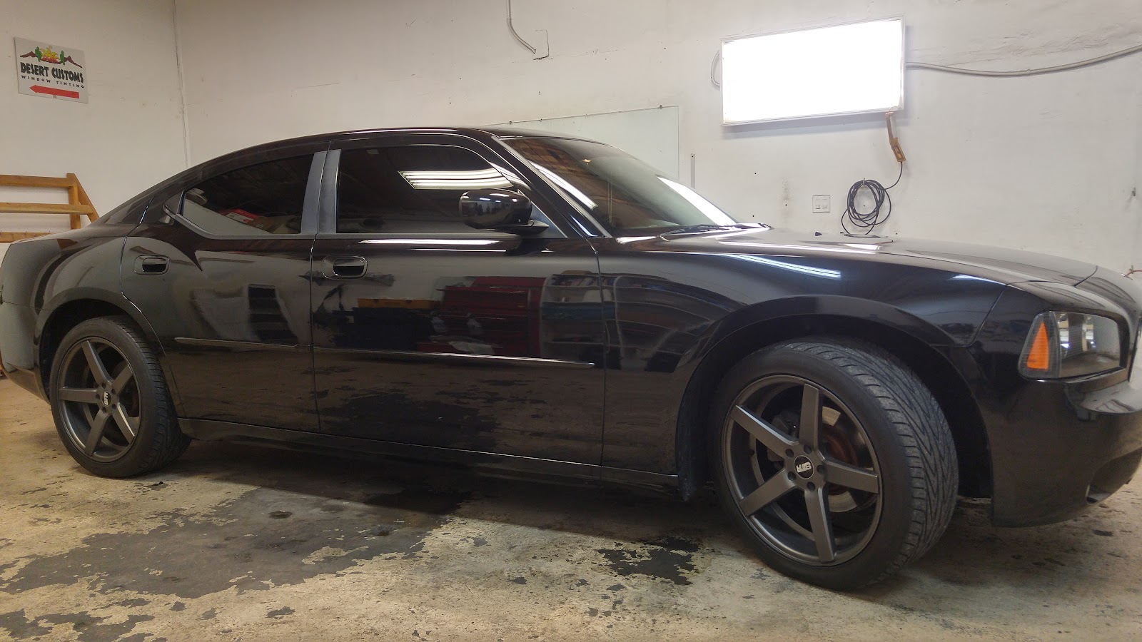 Black Dodge Charger with tinted windows in Desert Customs tint shop