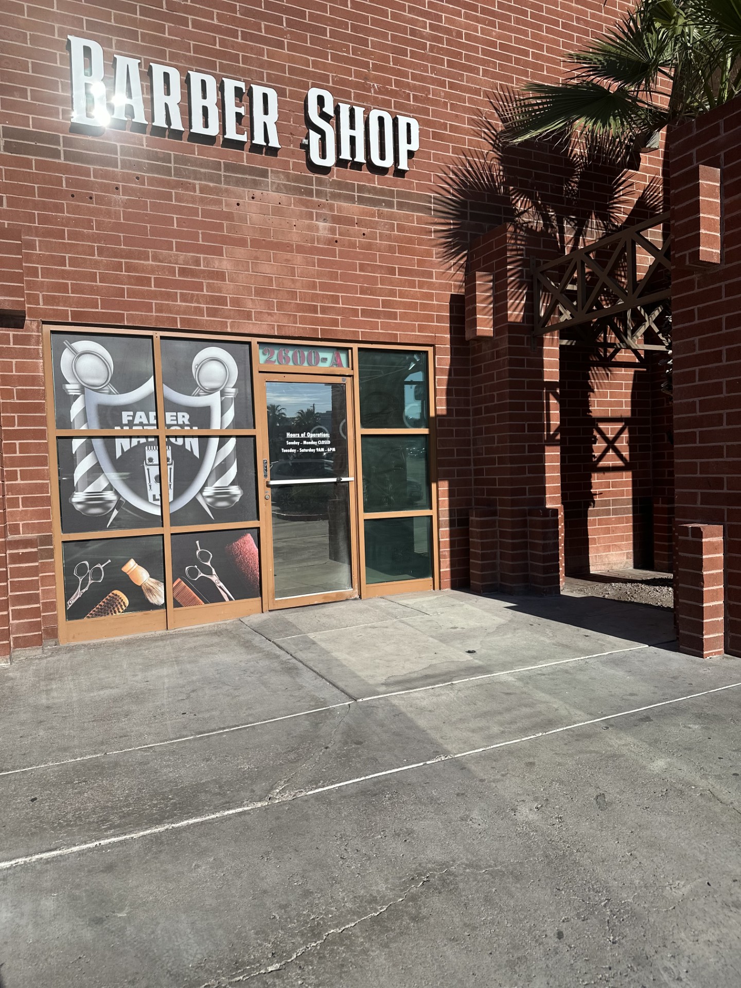 Exterior of Fader Nation Barber Shop storefront with signage