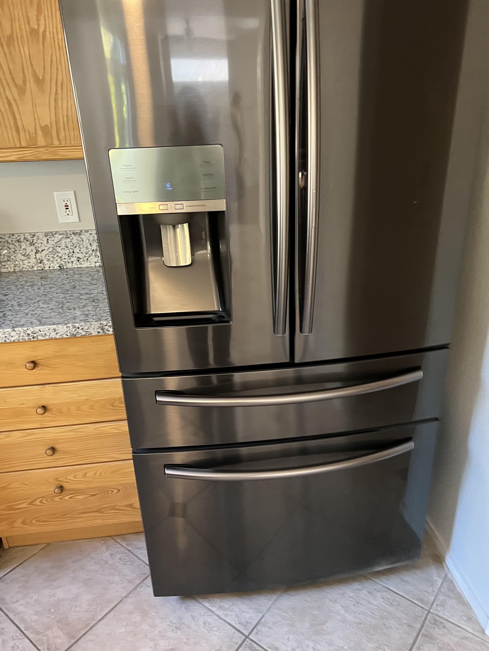 Clean stainless steel French-door refrigerator in kitchen