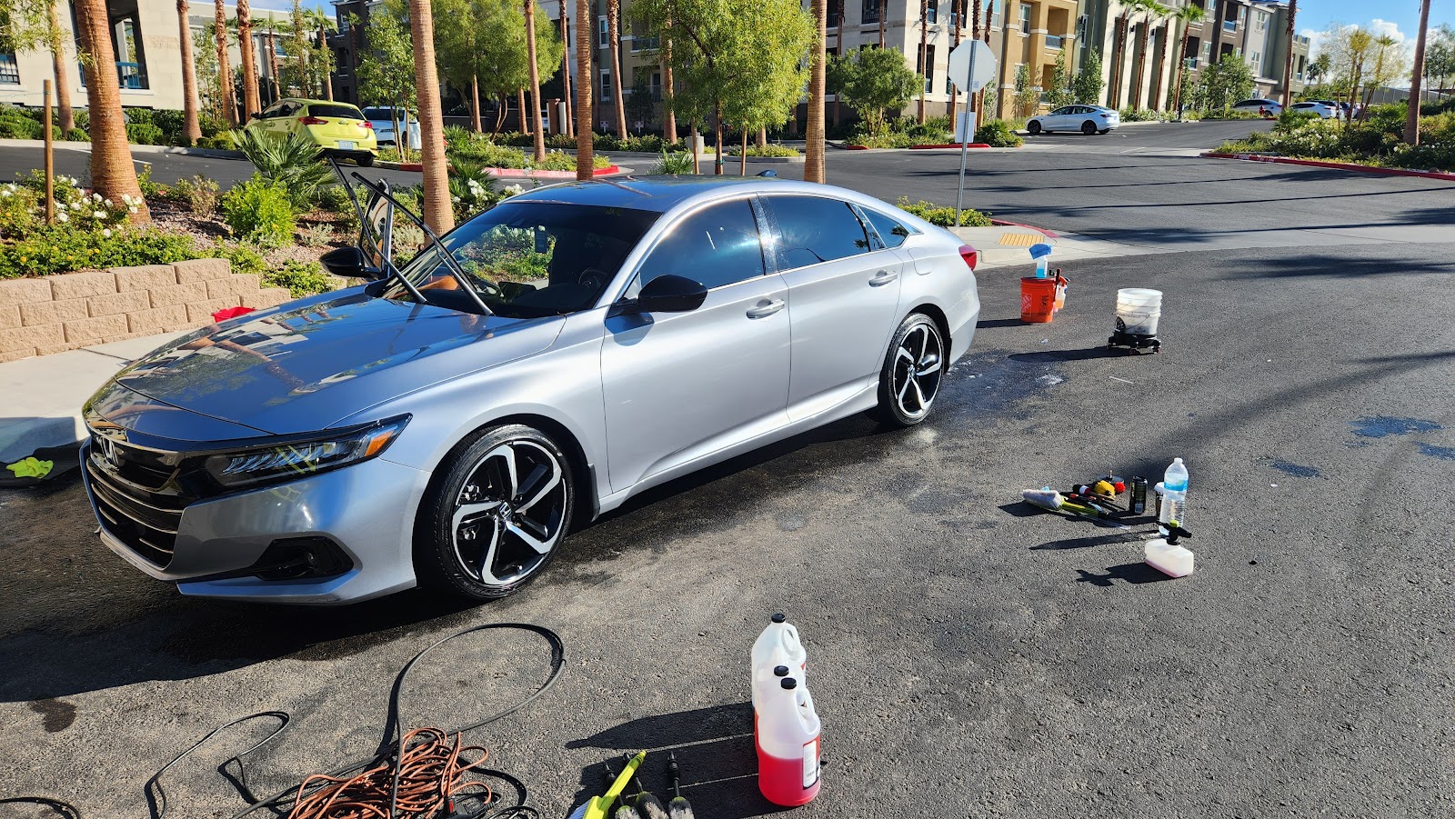 Silver Honda Accord Sport being detailed in an apartment complex parking lot