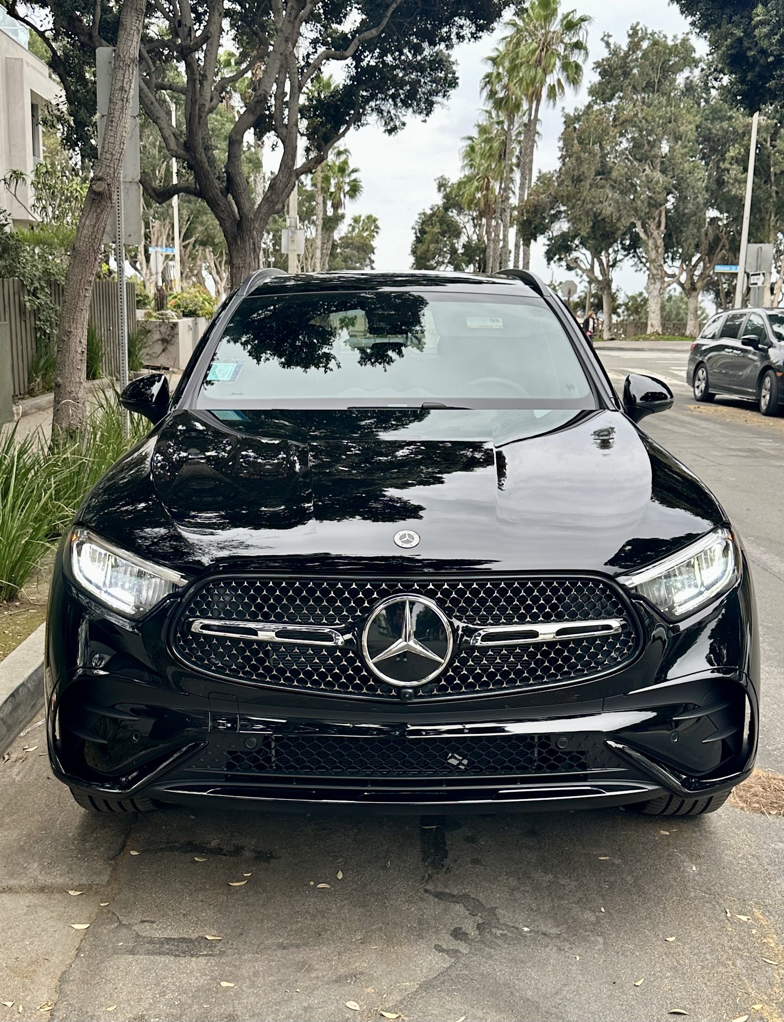 Front view of detailed black Mercedes-Benz GLC with clean grille and glossy hood