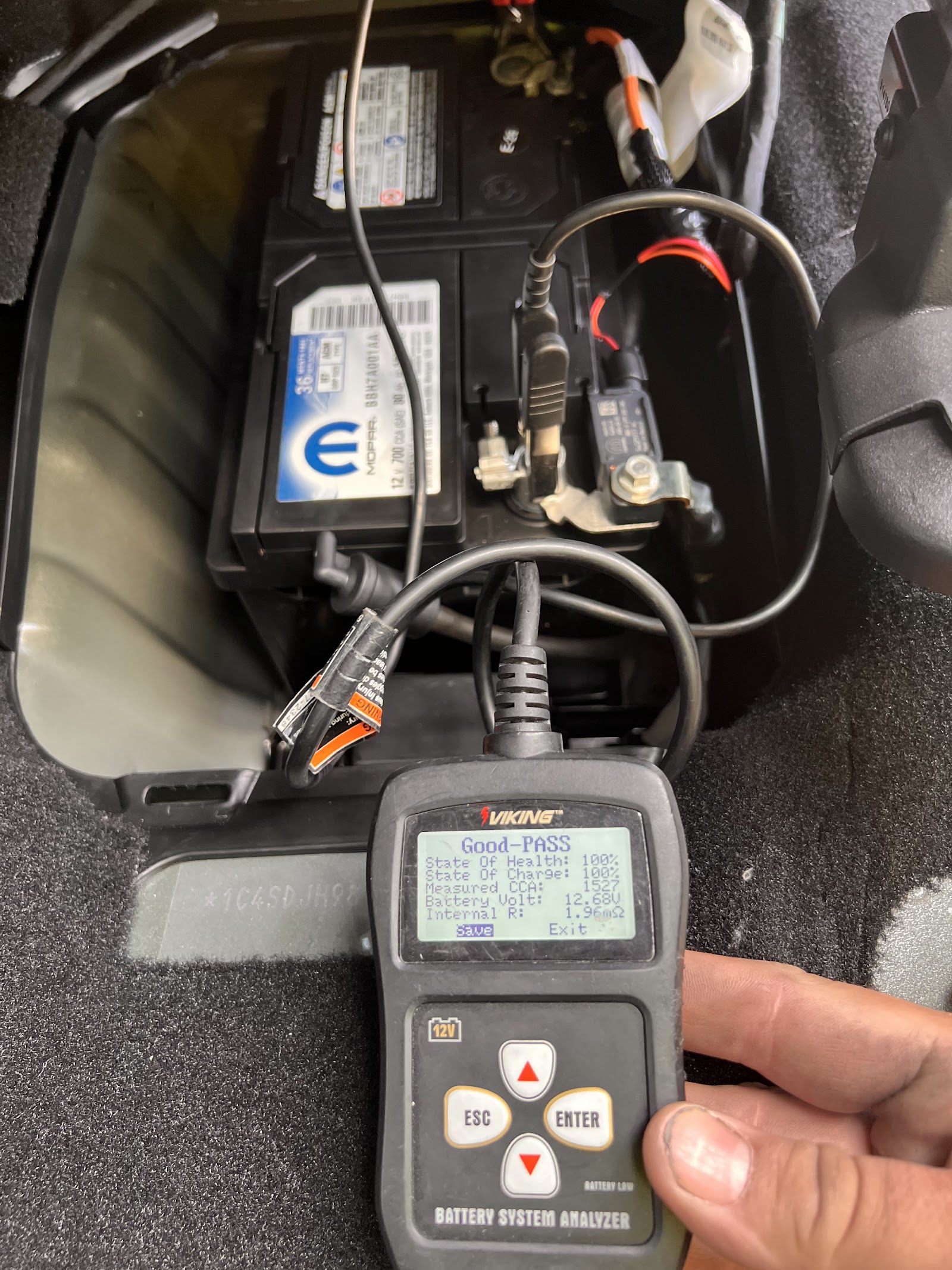 Battery analyzer showing 'Good-PASS' result after battery replacement