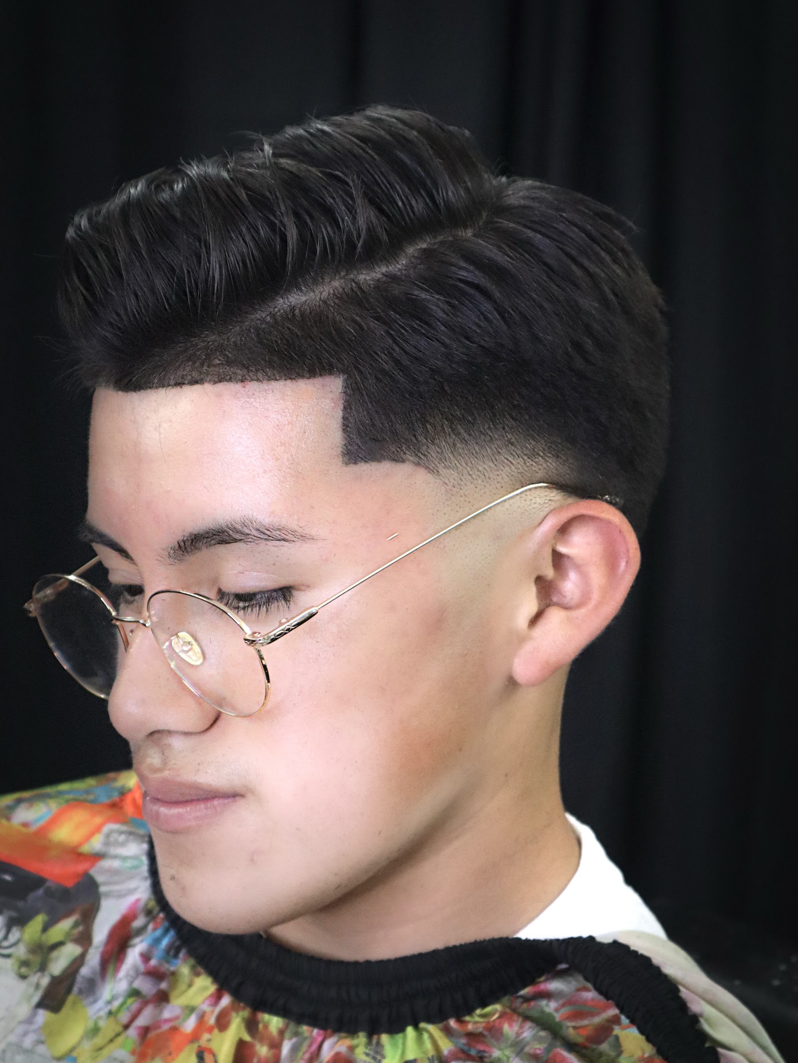 Clean pompadour with sharp line-up and skin fade