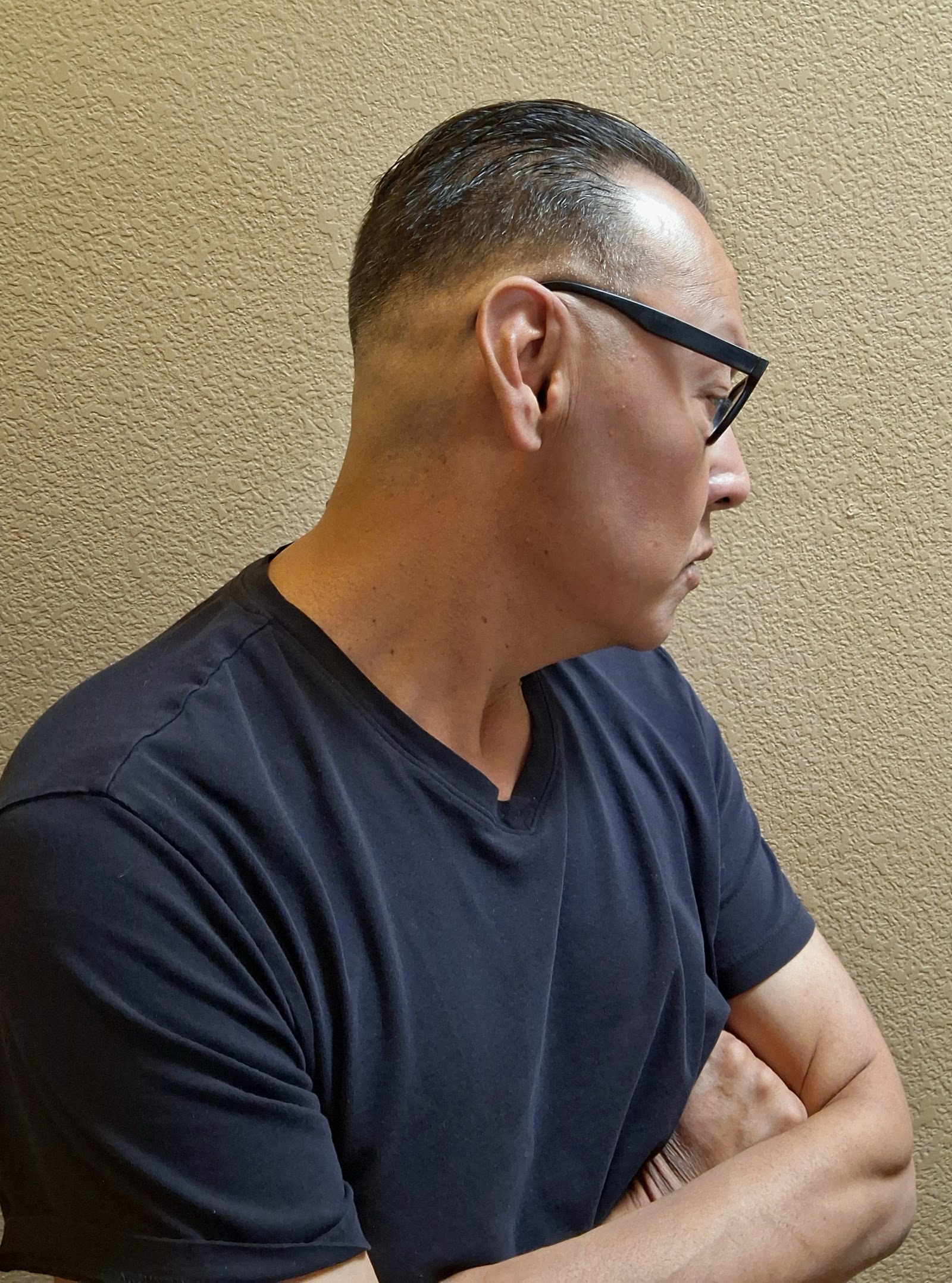 Side profile showing clean fade and tapered sides