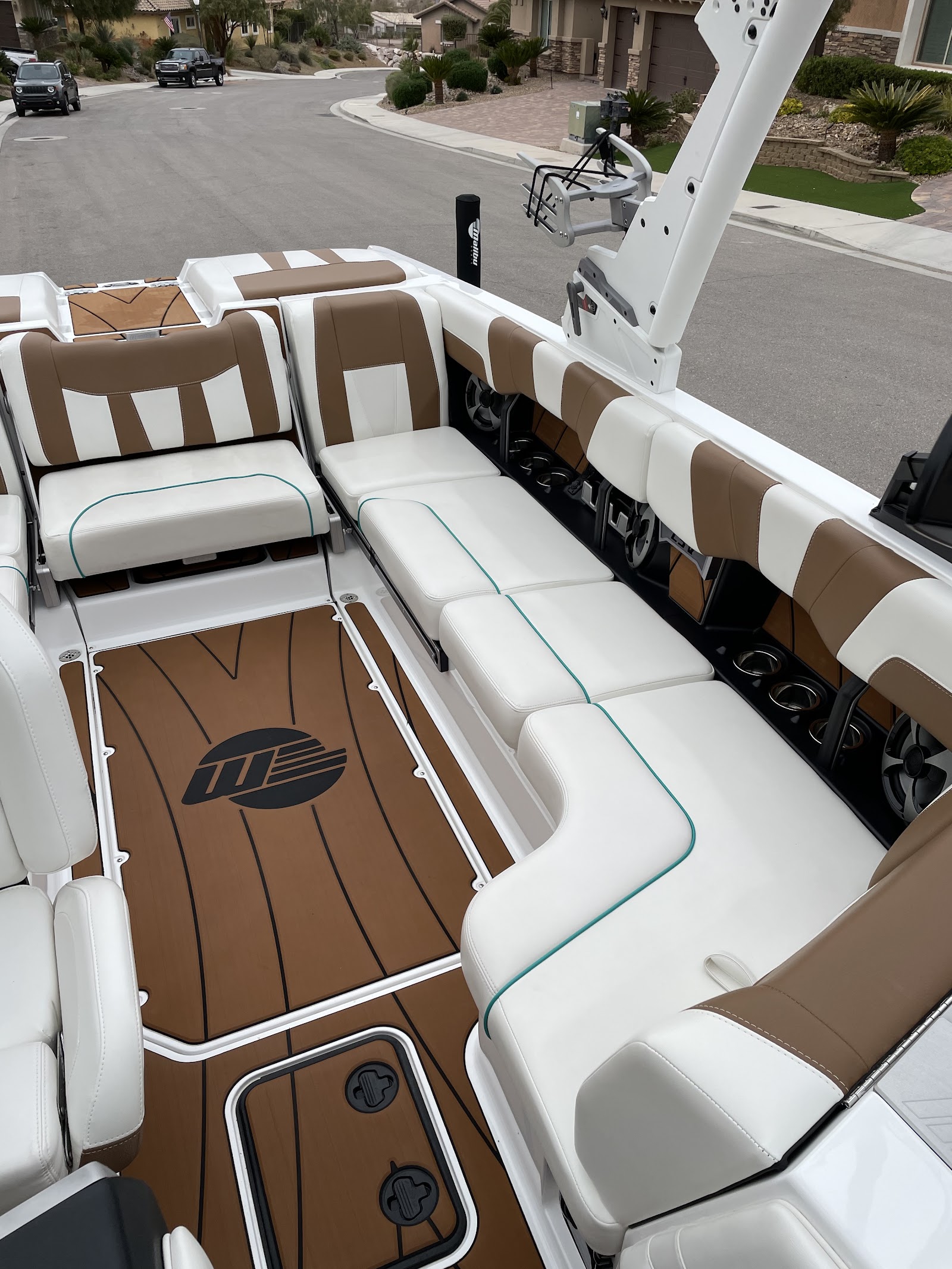 Detailed Malibu wakeboard boat interior with brown and white upholstery
