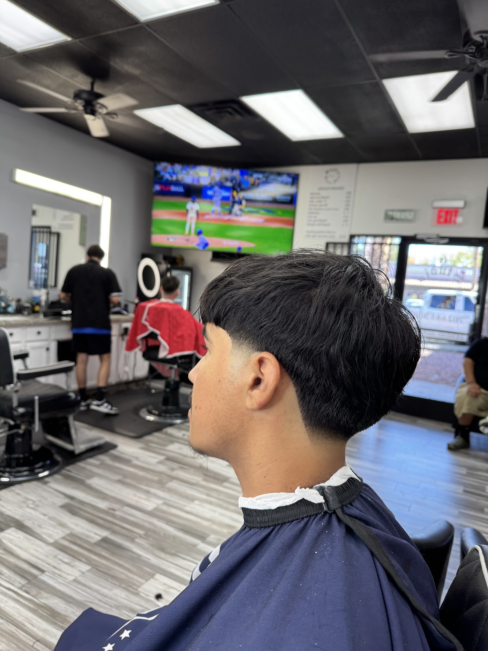 Side profile of a fresh textured haircut with faded sides