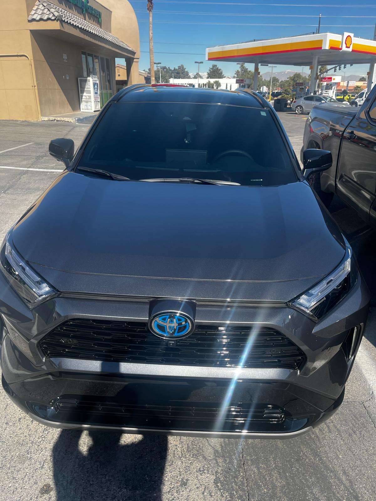 Gray Toyota RAV4 Hybrid with freshly tinted windows in a parking lot