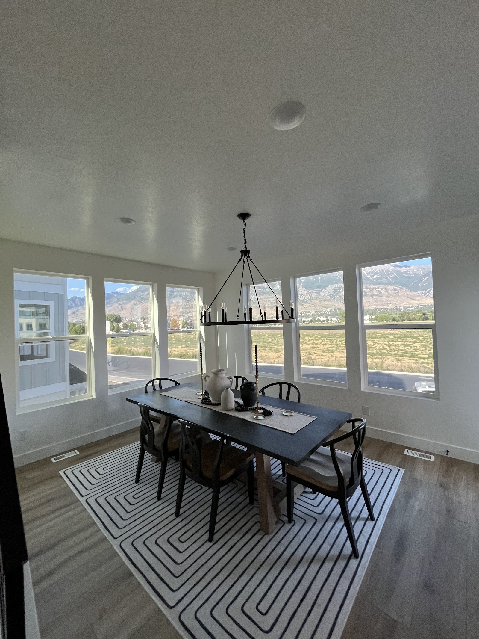 Dining room with large tinted windows overlooking mountain view